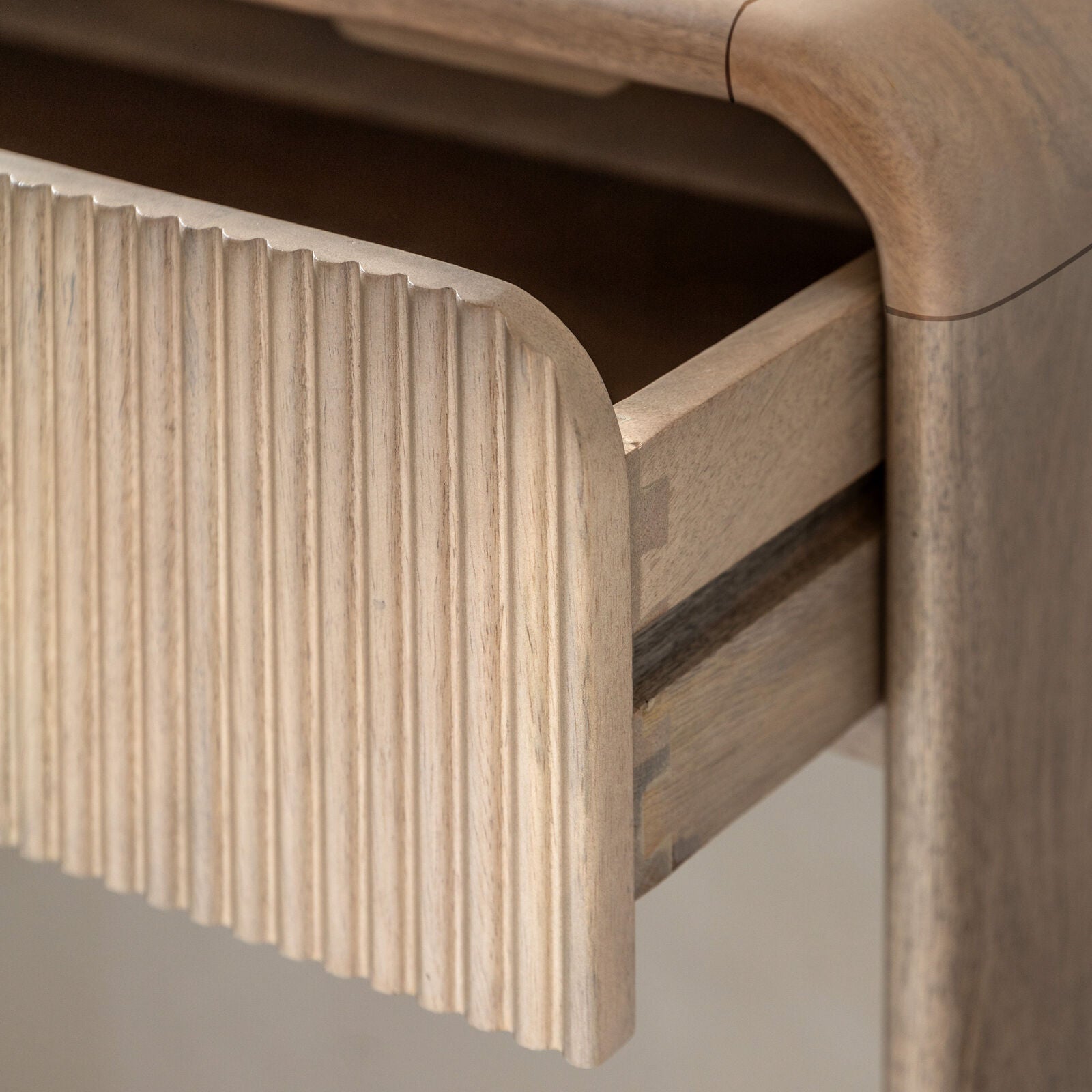 Rocca modern mango wood console table with curved edges and fluted drawers with brass hardware | malletandplane.com