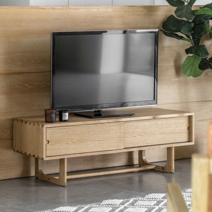 Artisan oak TV stand with 2 sliding doors and featuring cut out handles | malletandplane.com