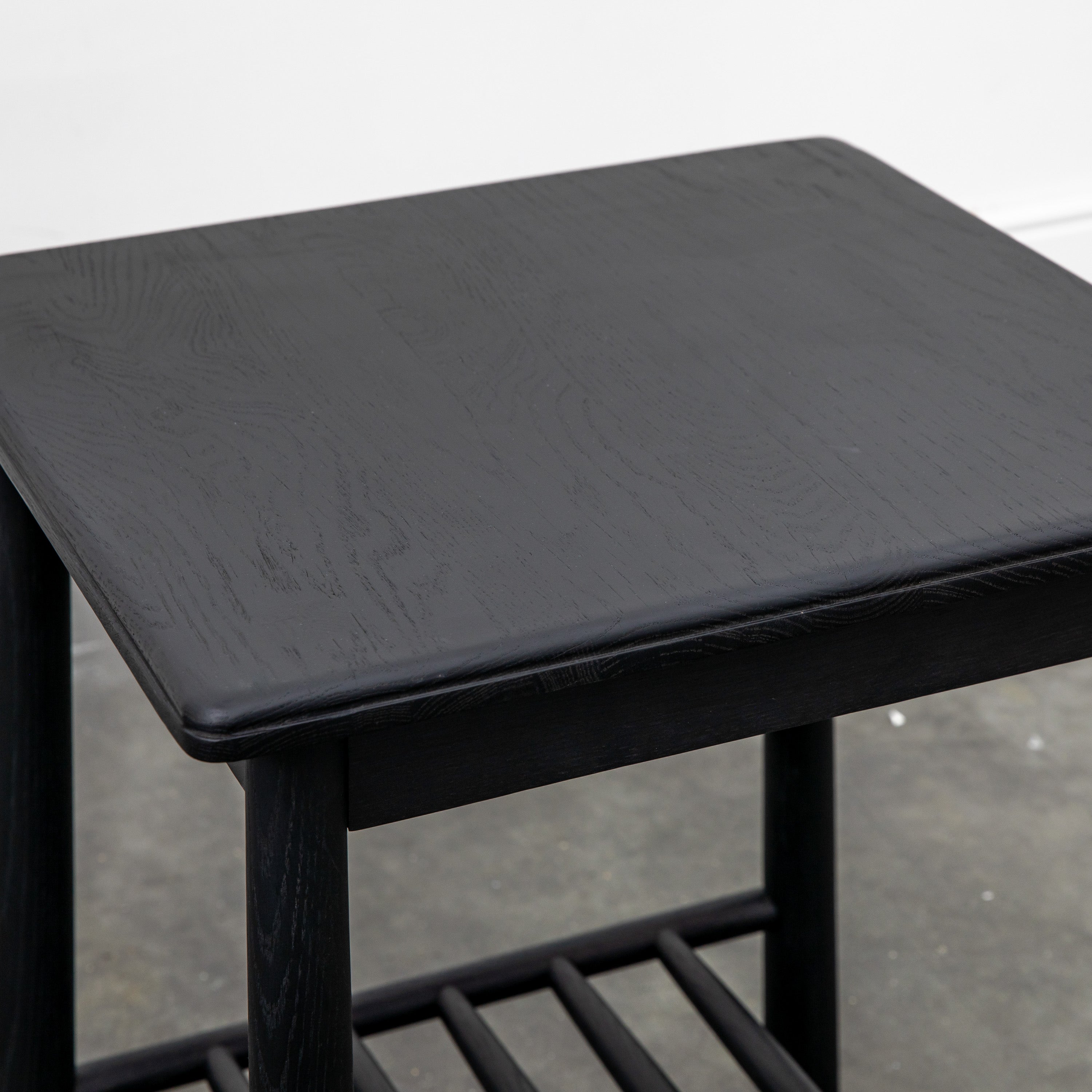 AXEL Nordic side table in black with spindle lower shelf | MalletandPlane.com