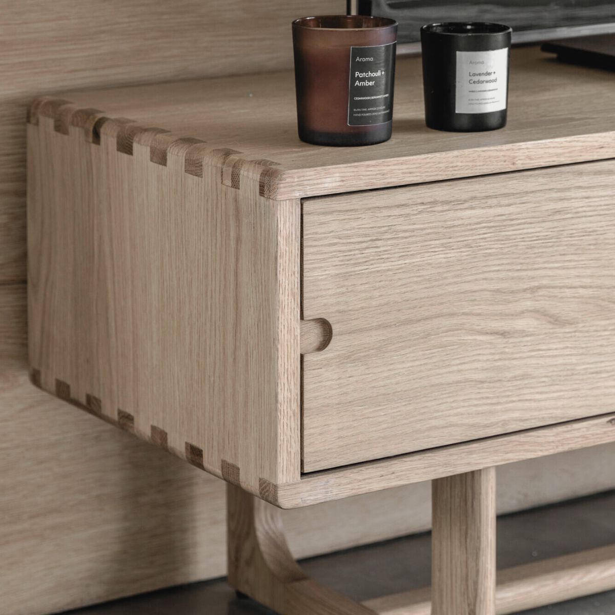 Artisan oak media unit with sliding doors and shaped underframe in natural finish | malletandplane.com