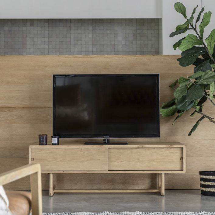 Artisan oak TV stand with 2 sliding doors and featuring cut out handles | malletandplane.com