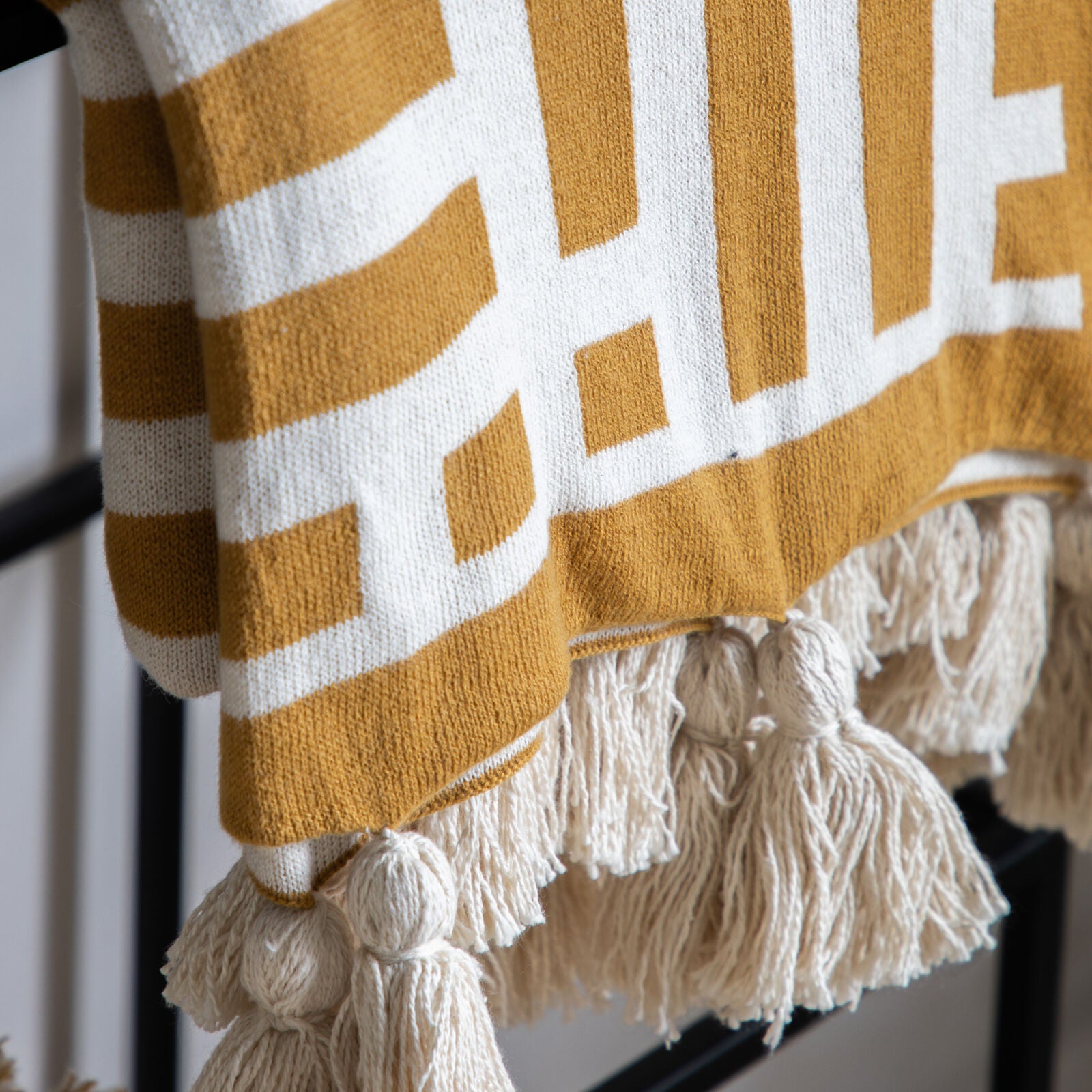 Decor contemporary knitted tassel cotton throw in black or ochre | malletandplane.com