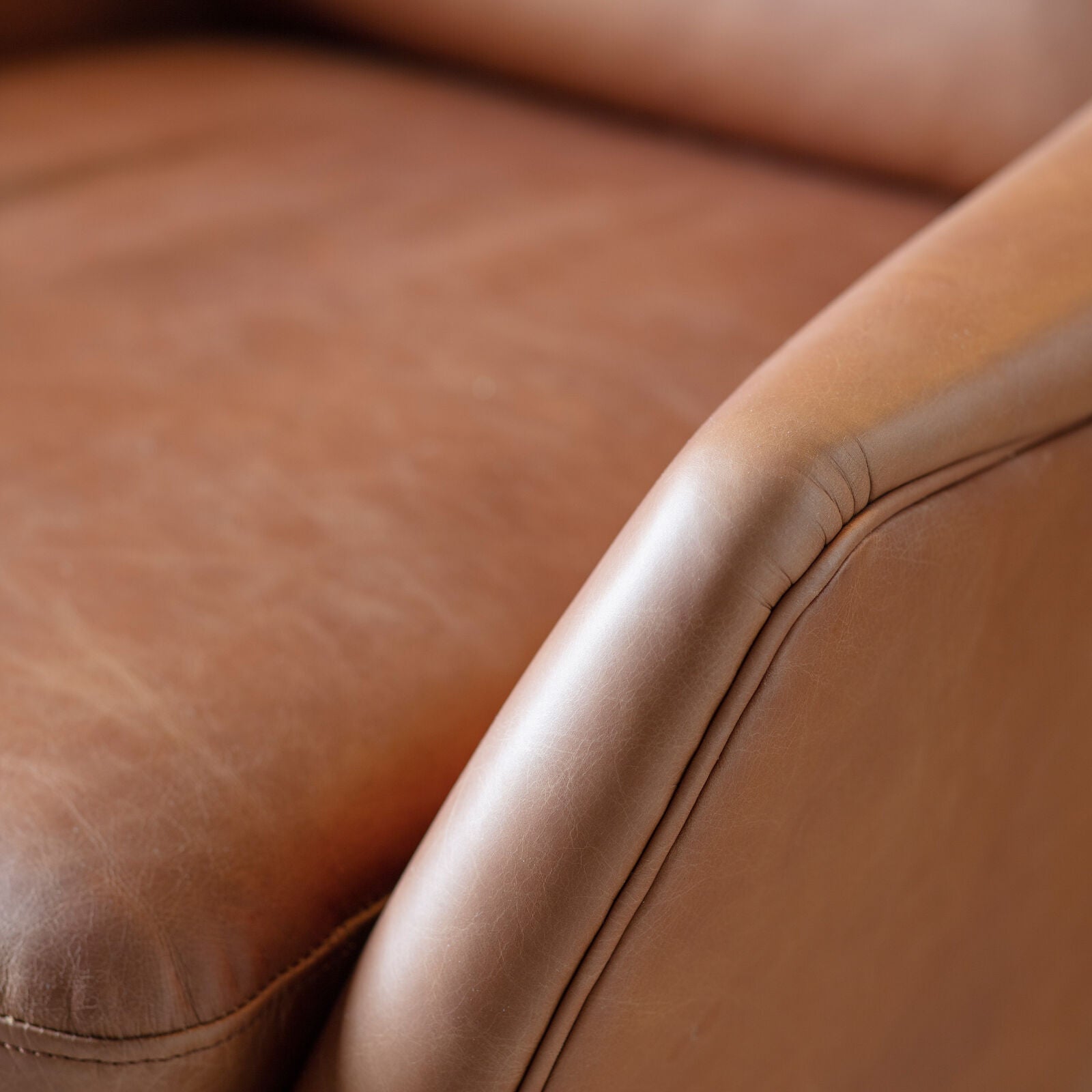 Frith Leather Armchair in brown leather with matt black metal legs | malletandplane.com