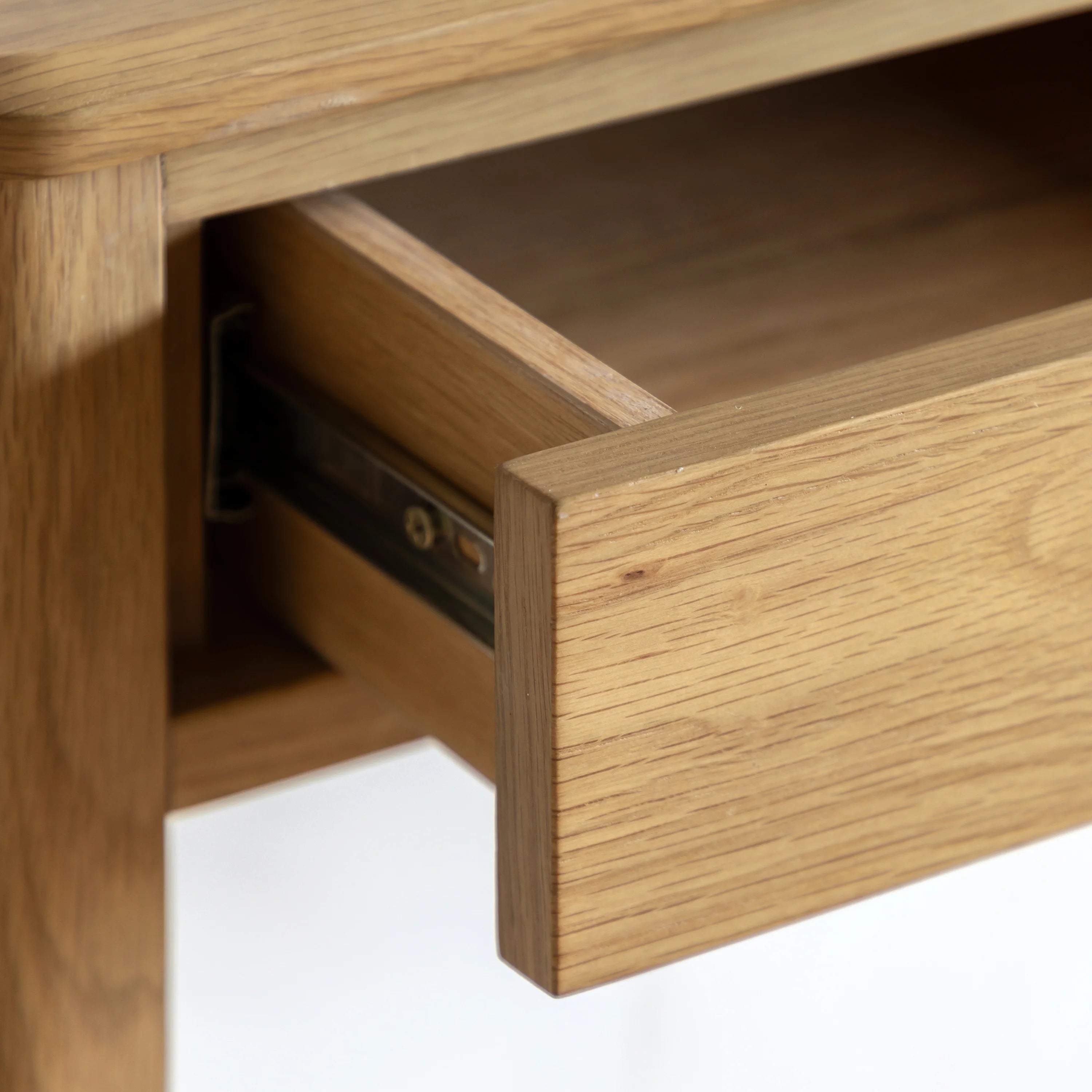 Wooden drawer being pulled out on a white background