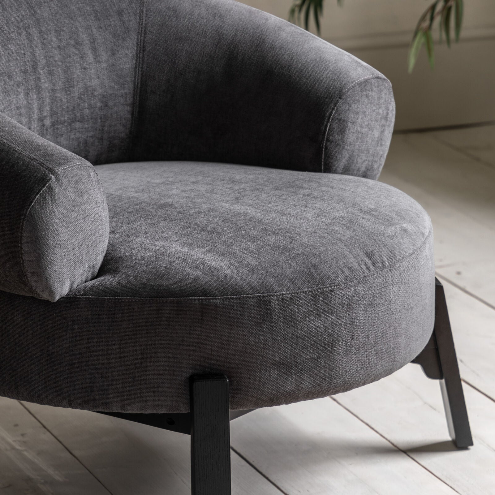 Harvey anthracite curved armchair with dark wood base frame and legs | malletandplane.com