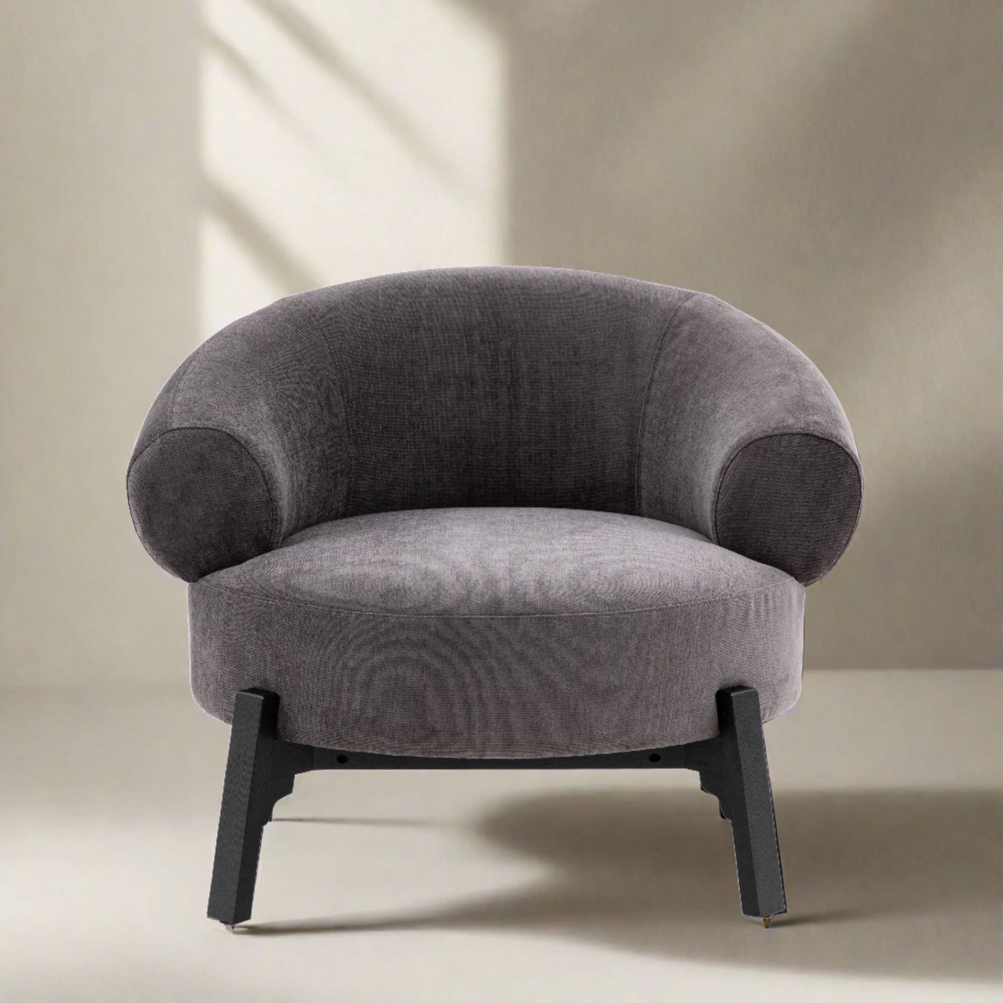 Harvey anthracite curved armchair with dark wood base frame and legs | malletandplane.com