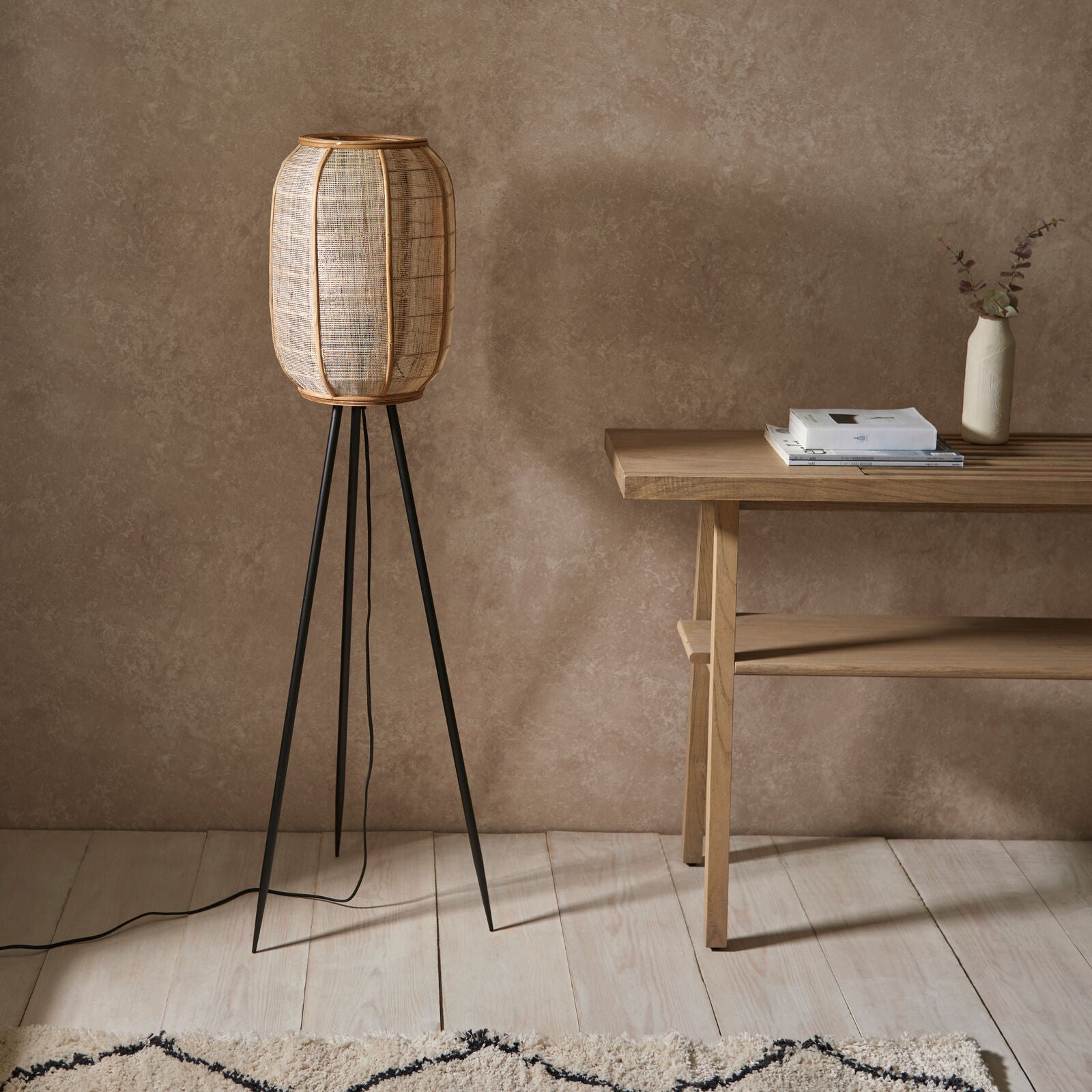 Bonobo tripod floor lamp with black legs and natural linen shade | malletandplane.com