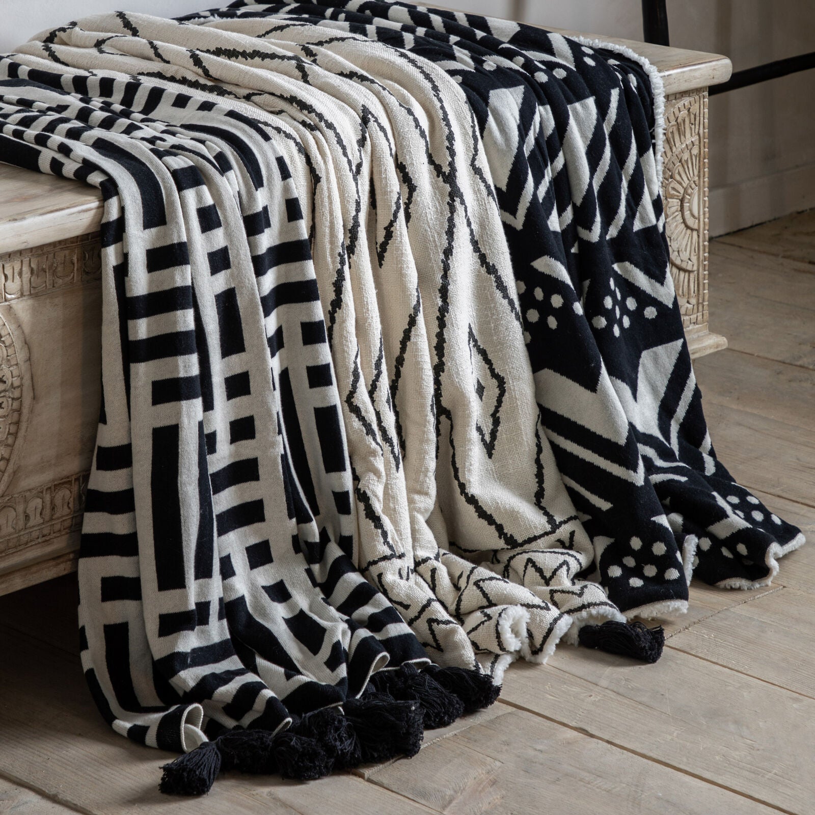 Sherpa natural throw with black pattern, black tassels and super cosy fleece back | malletandplane.com