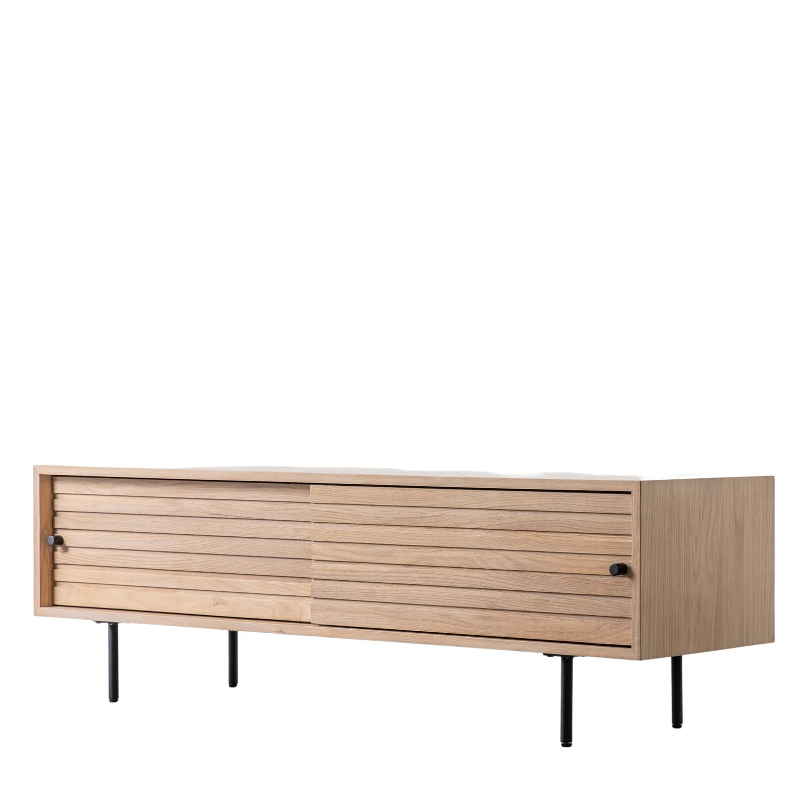 Soja TV stand with routed detailing in natural oak finish with black metal legs and sliding doors | malletandplane.com