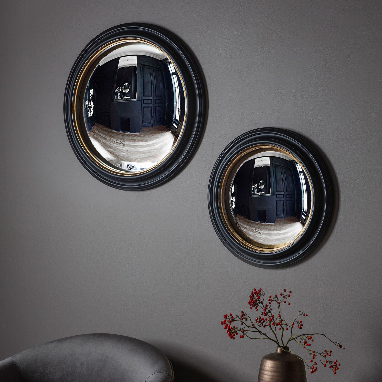 Brunel 630mm convex round wall mirror in black and gold finish | malletandplane.com