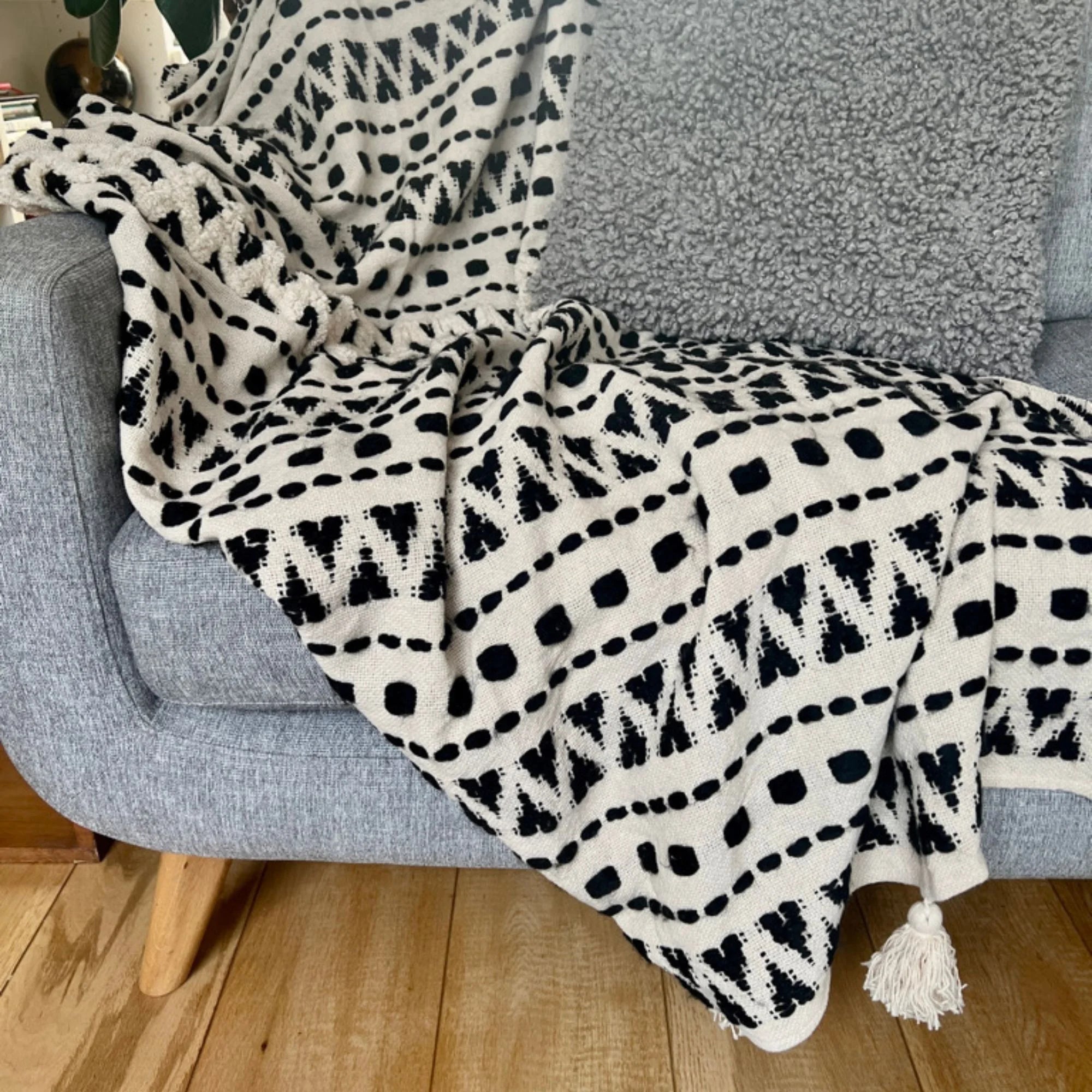 Aztec contemporary tufted cream throw with a beautiful black stitched aztec design | malletandplane.com