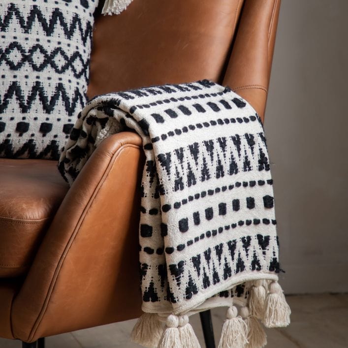 Aztec contemporary tufted cream throw with a beautiful black stitched aztec design | malletandplane.com