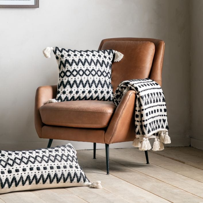 Aztec contemporary tufted cream throw with a beautiful black stitched aztec design | malletandplane.com