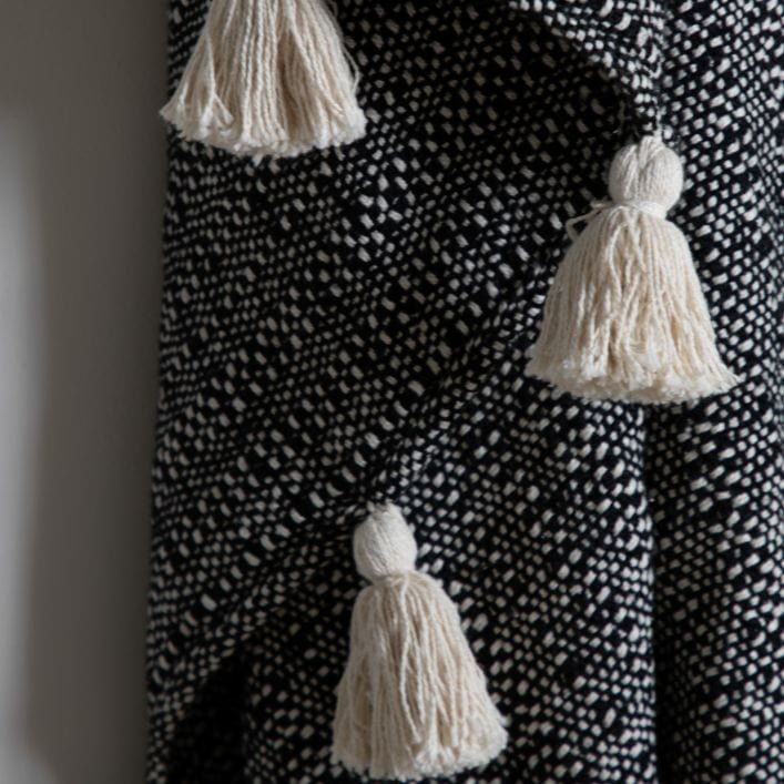 Dustin polycotton tassel throw with woven cream and black pattern | malletandplane.com