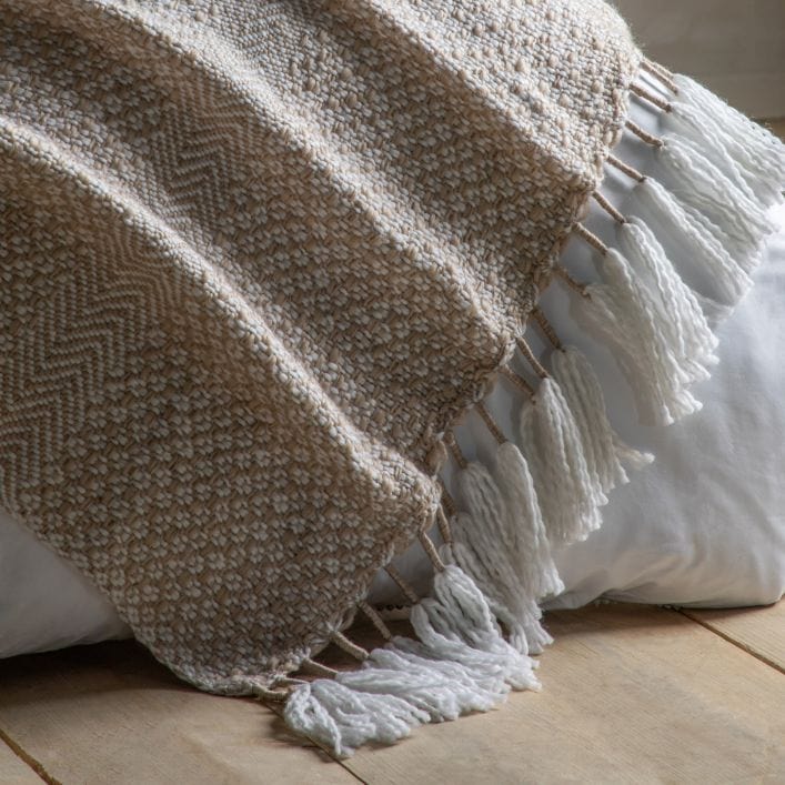 Lionel natural throw with neutral woven design and large wite tassels | malletandplane.com