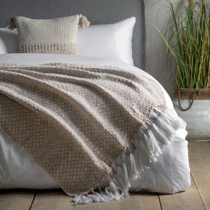 Lionel natural throw with neutral woven design and large wite tassels | malletandplane.com