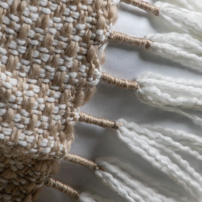 Lionel natural throw with neutral woven design and large wite tassels | malletandplane.com