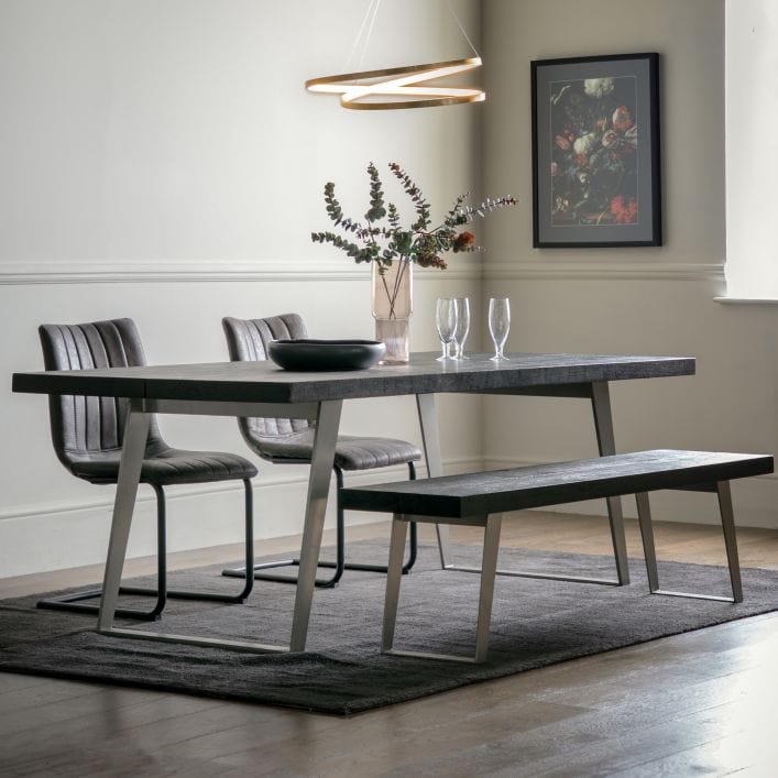 Pimlico solid black acacia wood dining table with silver angular metal legs | malletandplane.com