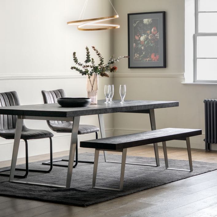 Pimlico solid black acacia wood dining table with silver angular metal legs | malletandplane.com